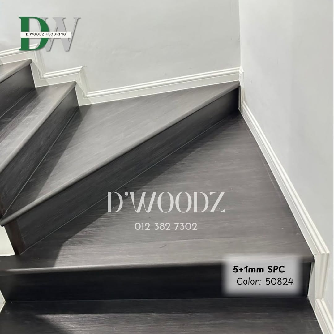 A charcoal-clad staircase turning at a landing, with white skirting; the D'Woodz watermark and product label in frame.