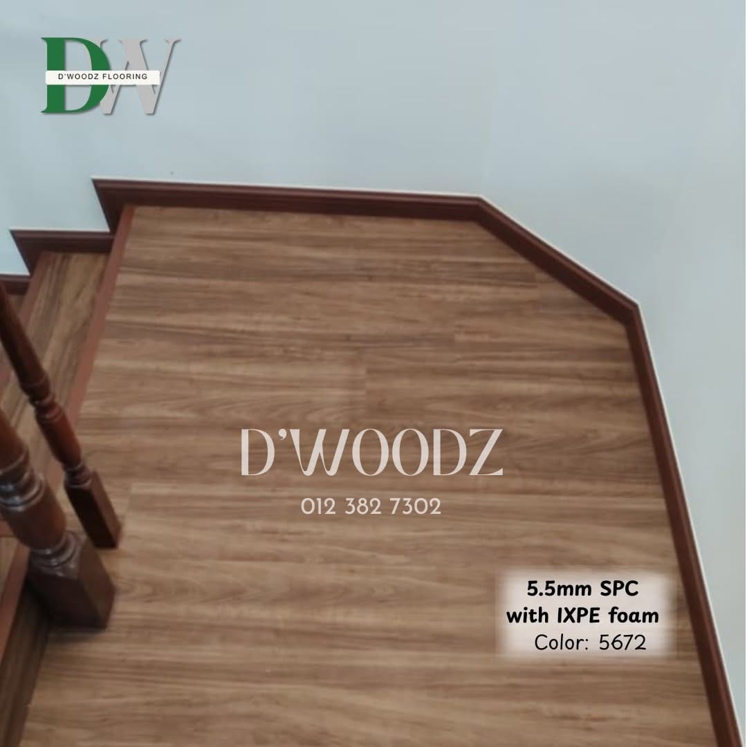 A walnut-toned clad staircase turning at a landing beside a dark turned-timber balustrade; the D'Woodz watermark and product label in frame.